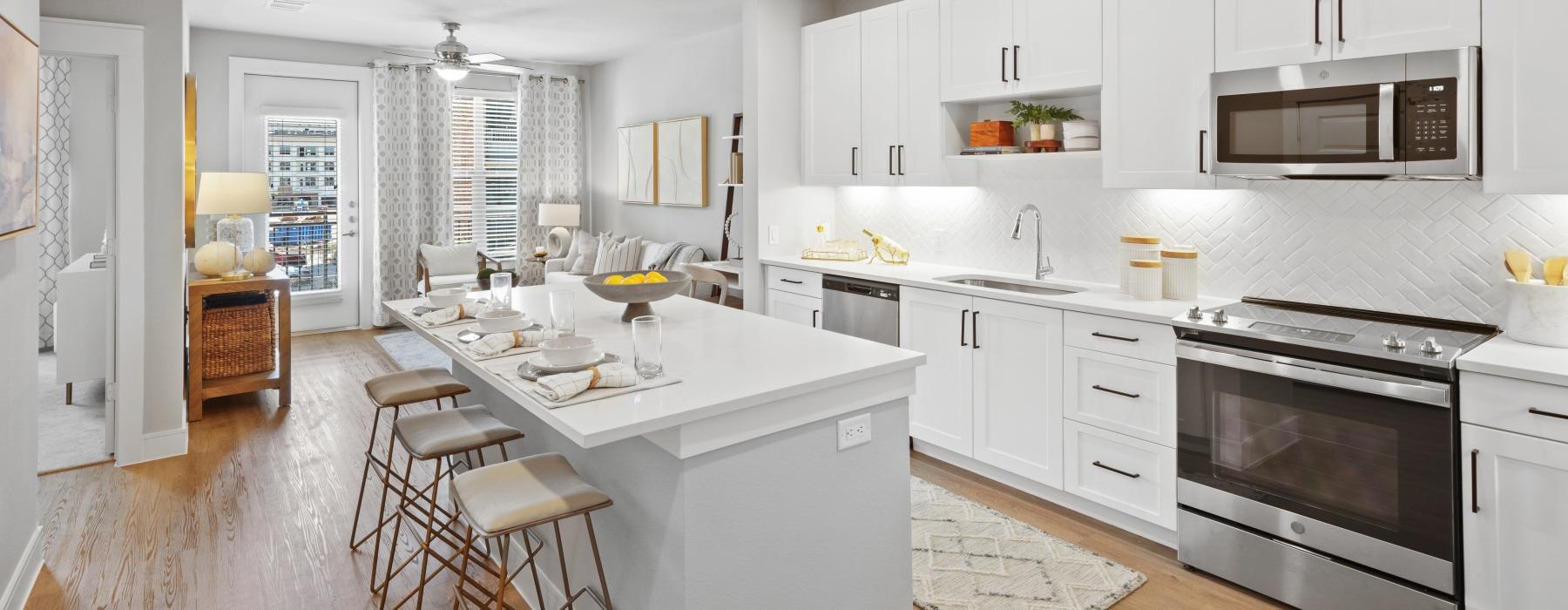 a kitchen with white cabinets