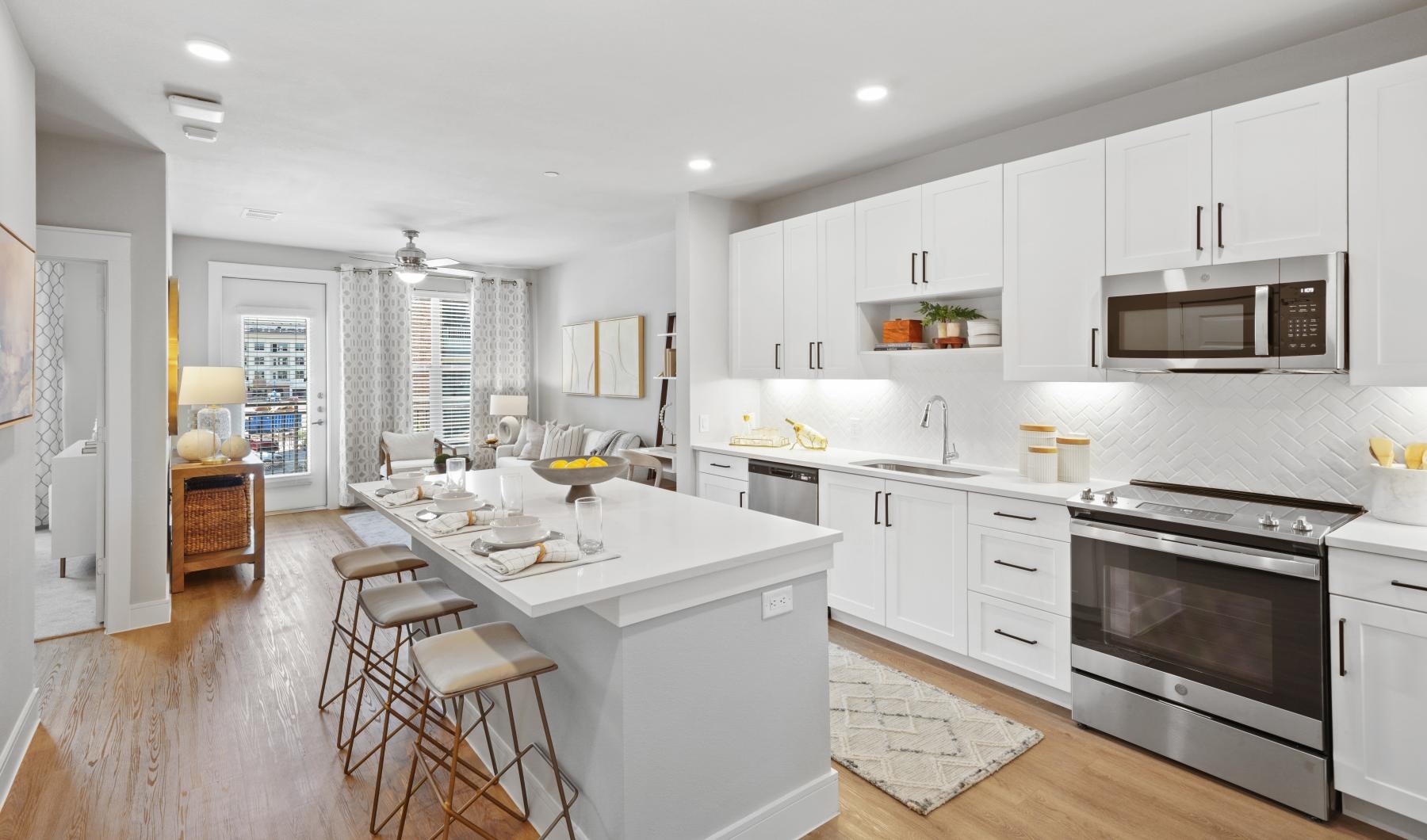 a kitchen with white cabinets