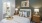 Bedroom with bathroom and high ceilings