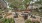 a courtyard with chairs and tables and trees