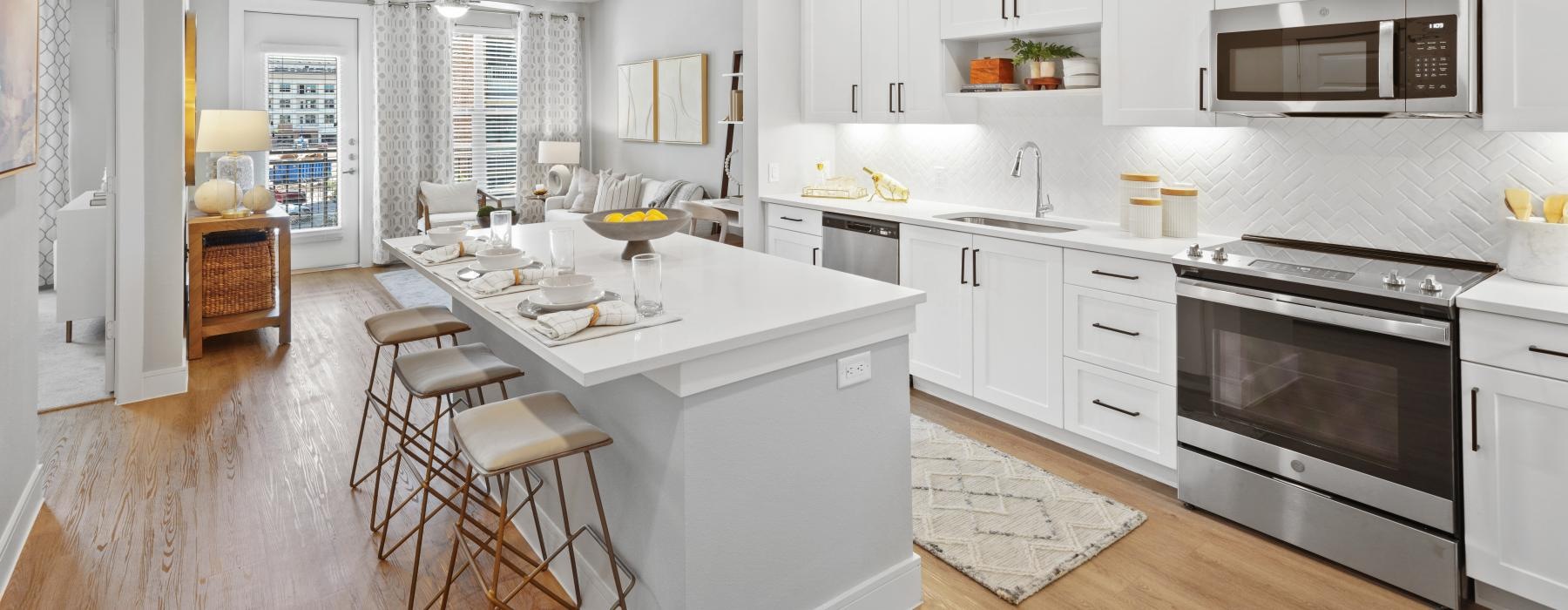 a kitchen with white cabinets